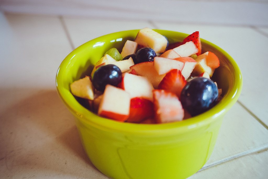 fruit salad in a green bowl