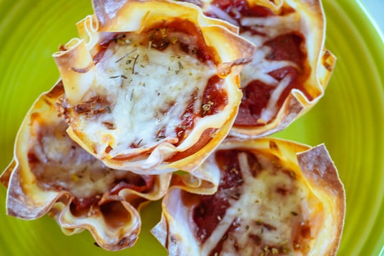 turkey pepperoni pizza cupcakes on a green plate