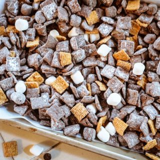 smores puppy chow on a baking sheet