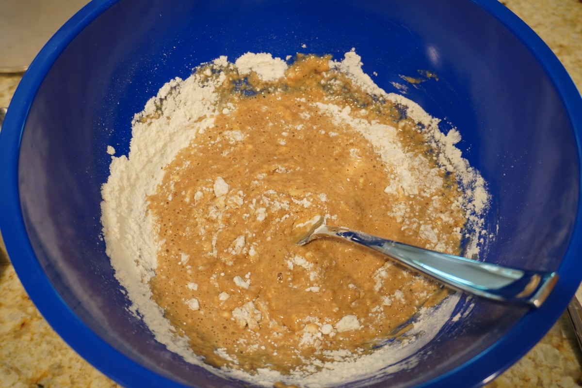 mixing in flour into the batter