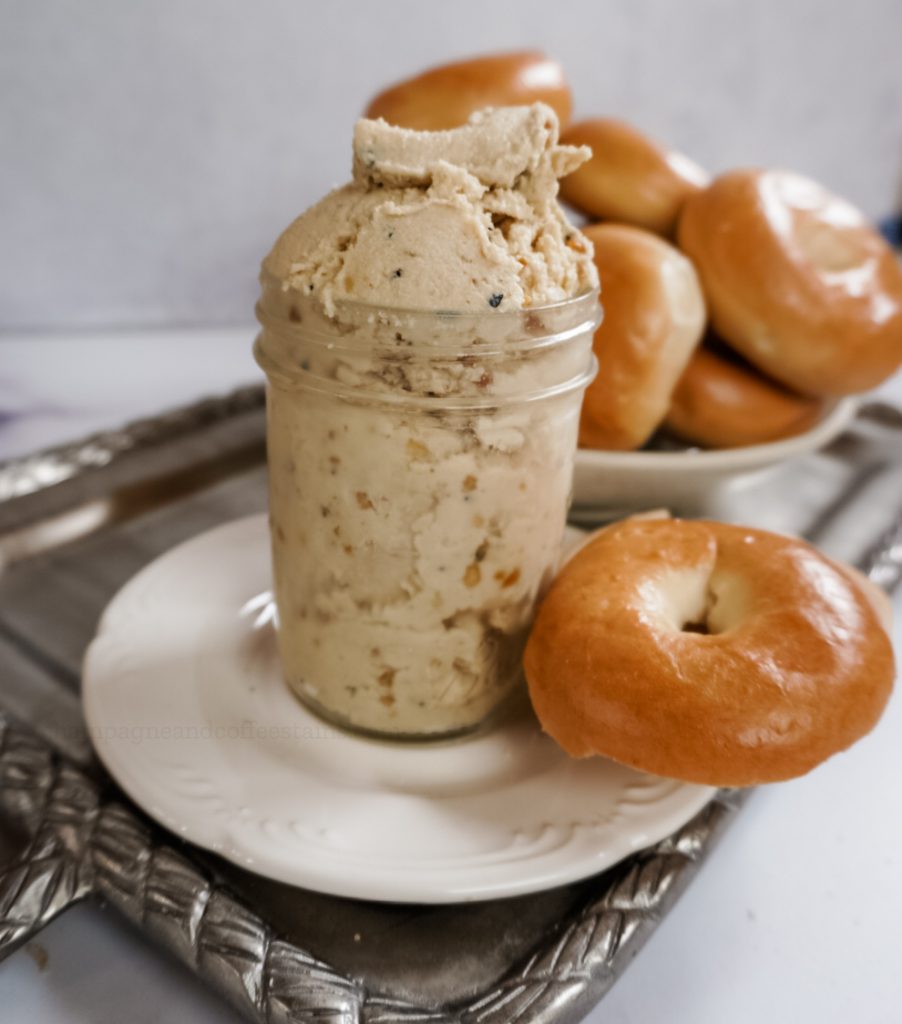 a jar of vegan everything cream cheese with a bagel