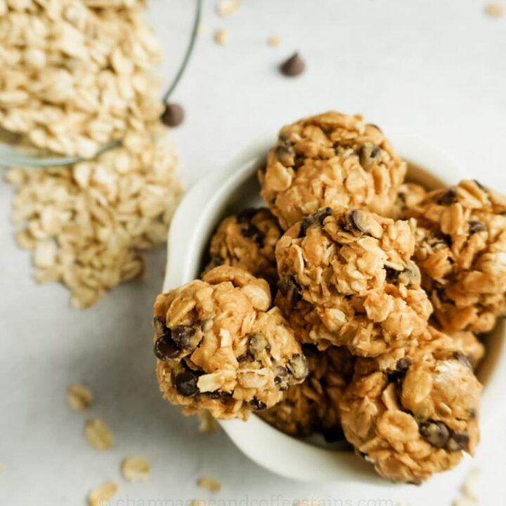 bowl of peanut butter bites with oatmeal on the side