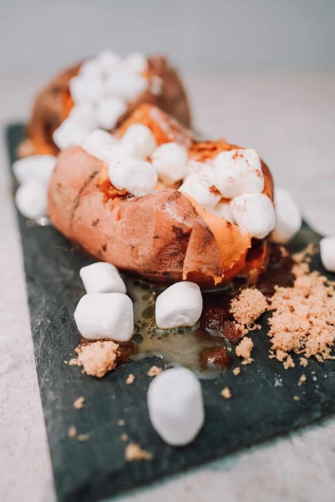 instant pot sweet potatoes on a plate with marshmallows