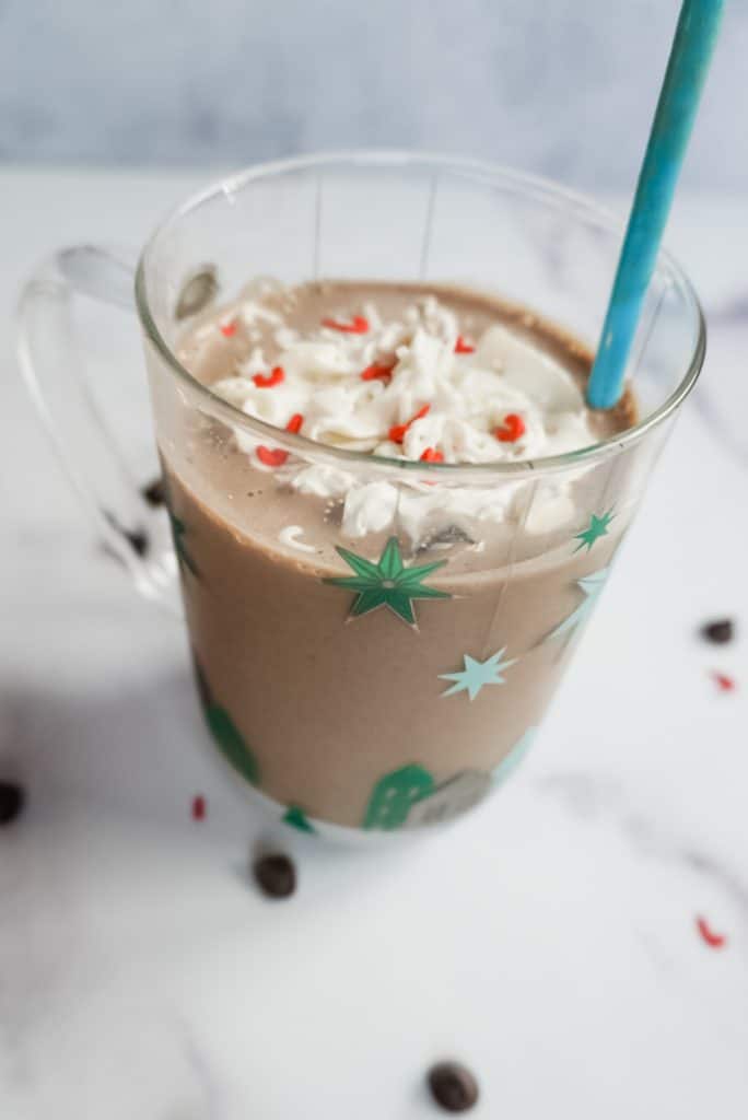 side vegan peppermint mocha protein shake in a christmas glass