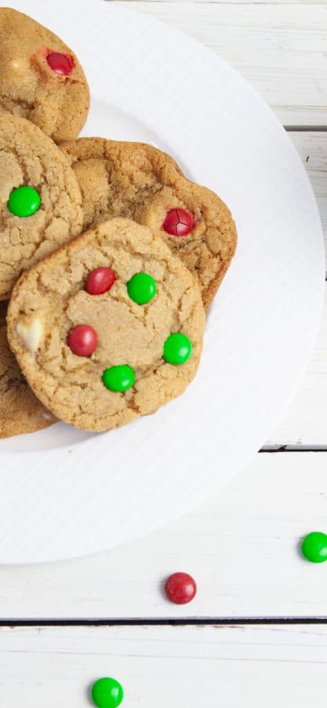 m&m cookies on a white plate with red and green m&ms