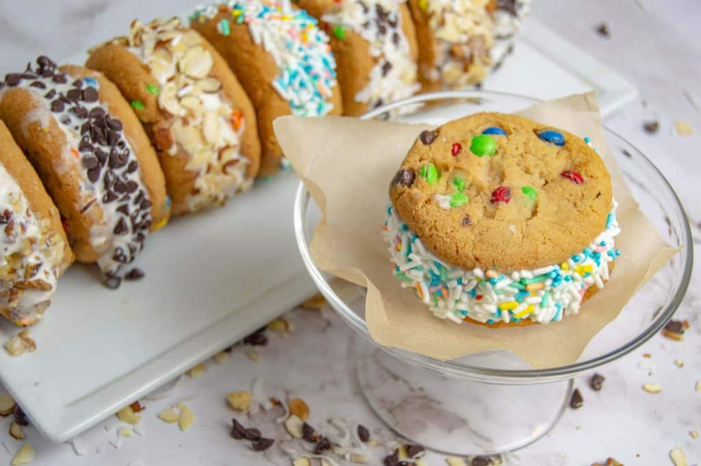 close up of ice cream sandwich with m&m cookies