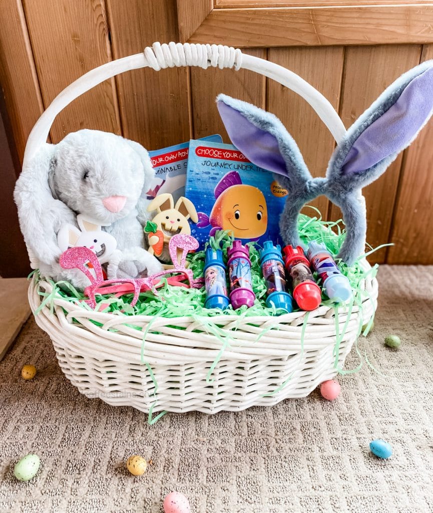 front of a toddler easter basket with easter eggs