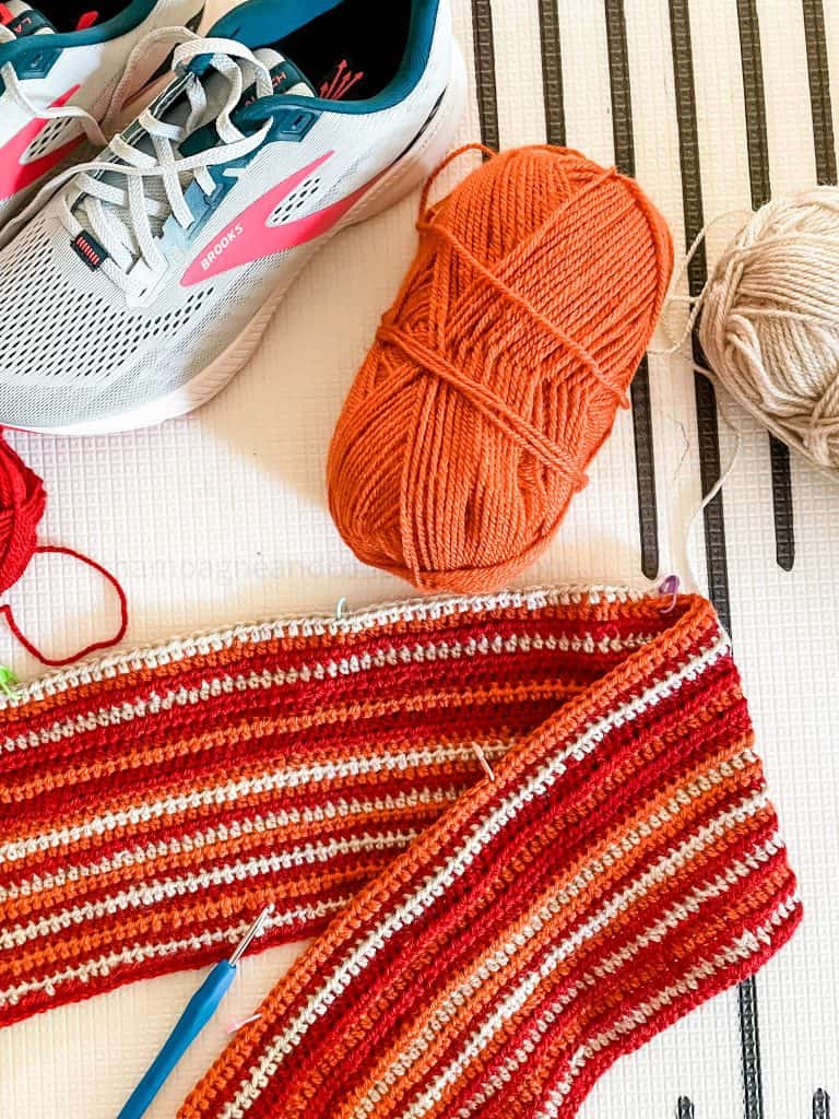 marthon blanket with yarn and a running shoe