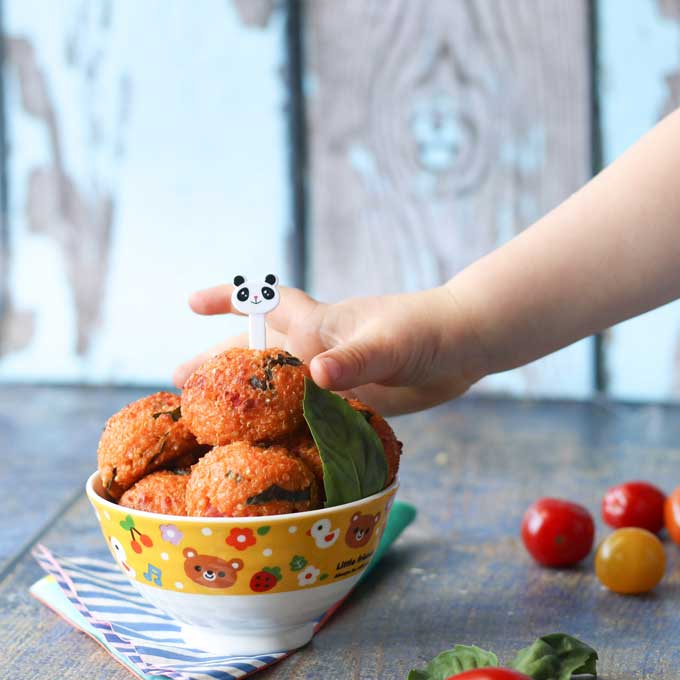 tomato and basil quinoa balls in a bowl