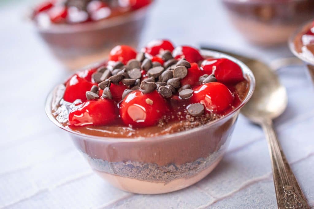 finished no bake chocolate cherry cheesecake in a bowl