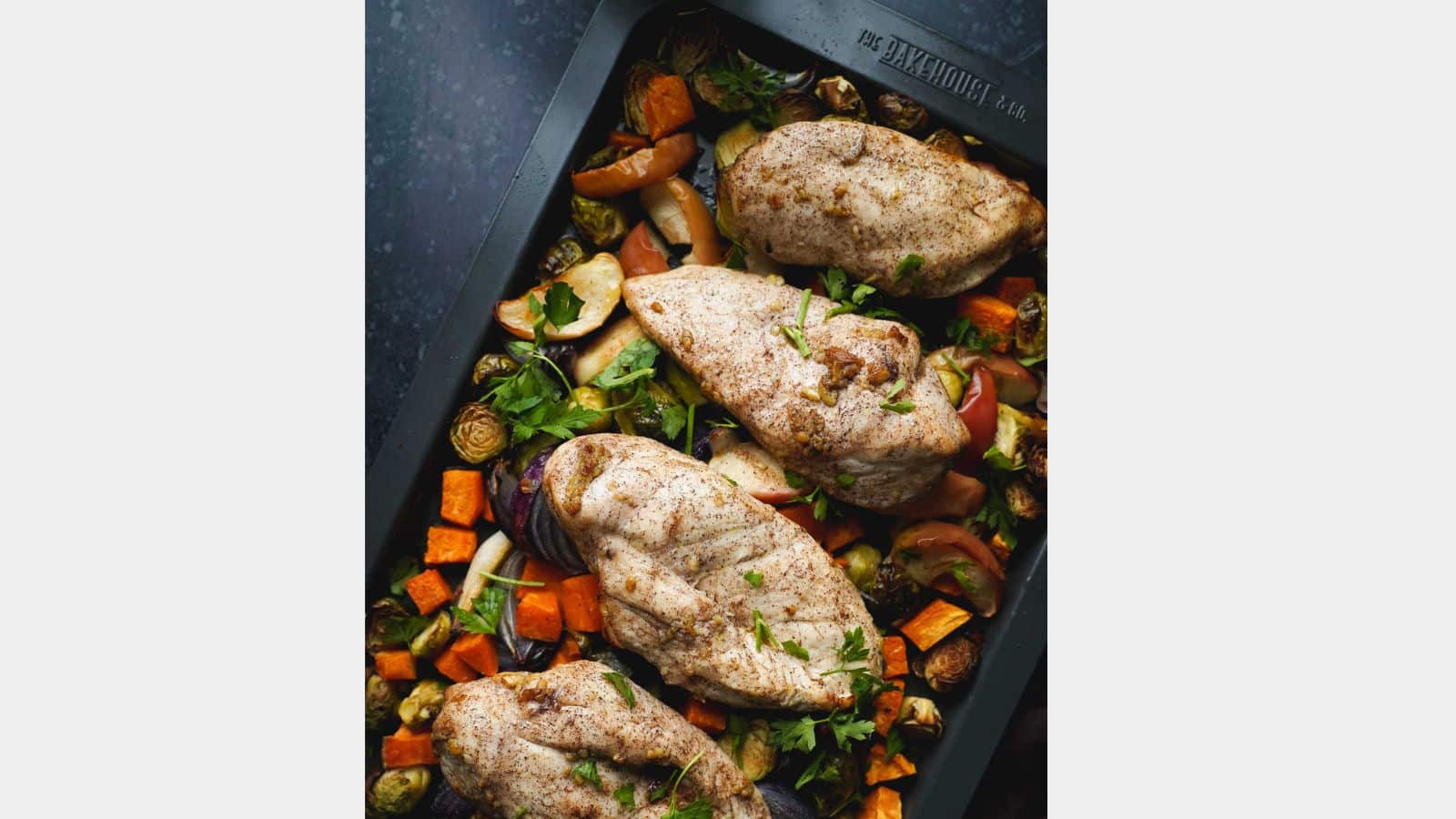 chicken with potatoes on a sheet pan