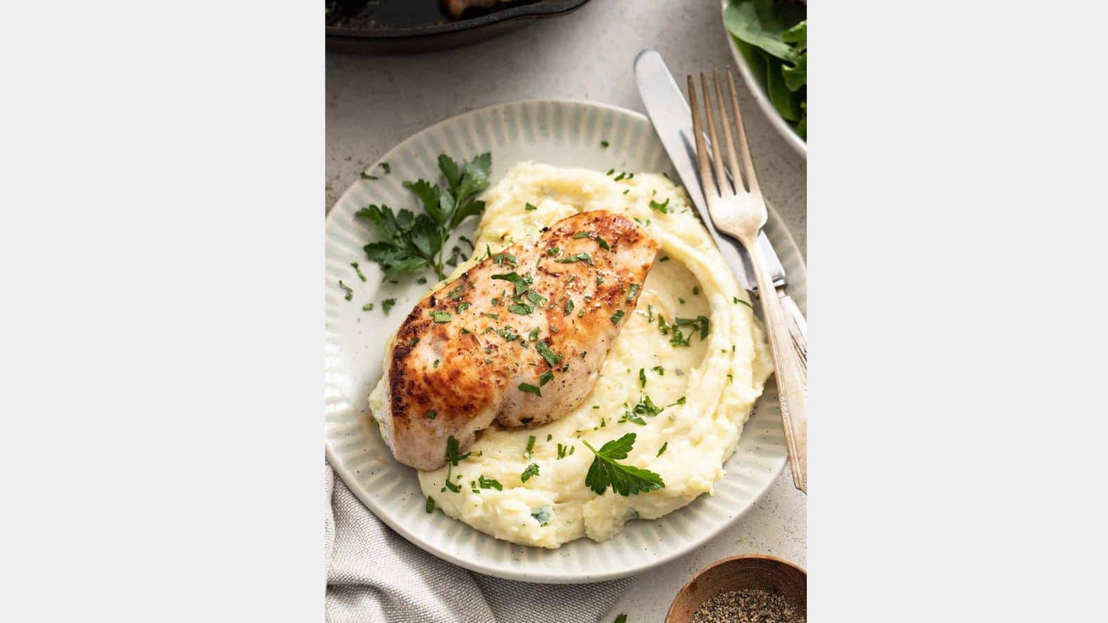 ricotta chicken on mashed potatoes in a bowl