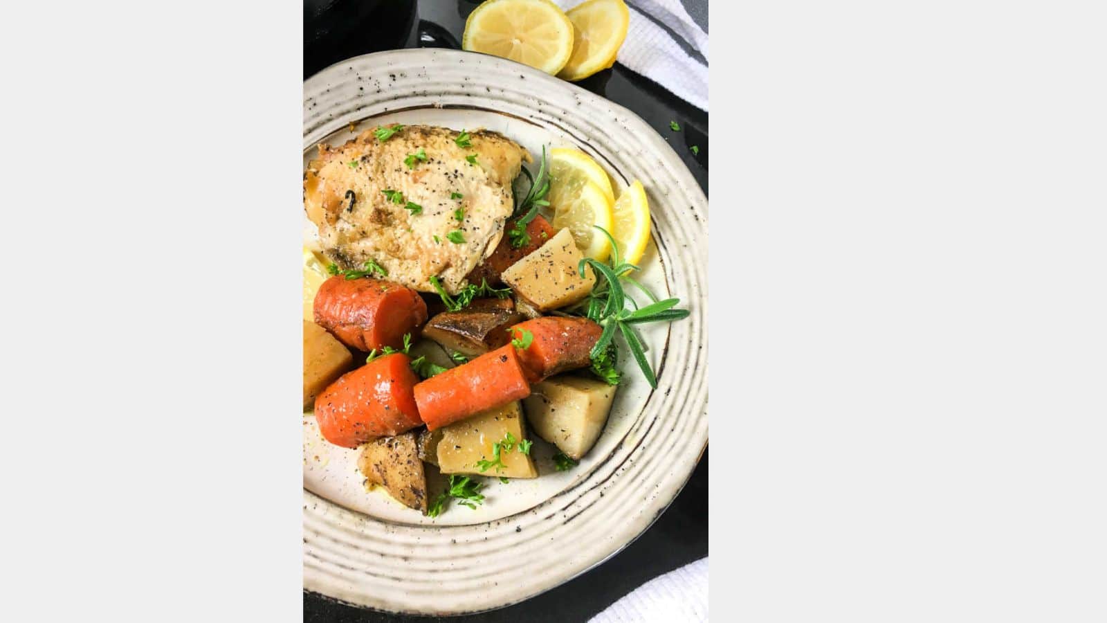 rosemary chicken on a plate with veggies