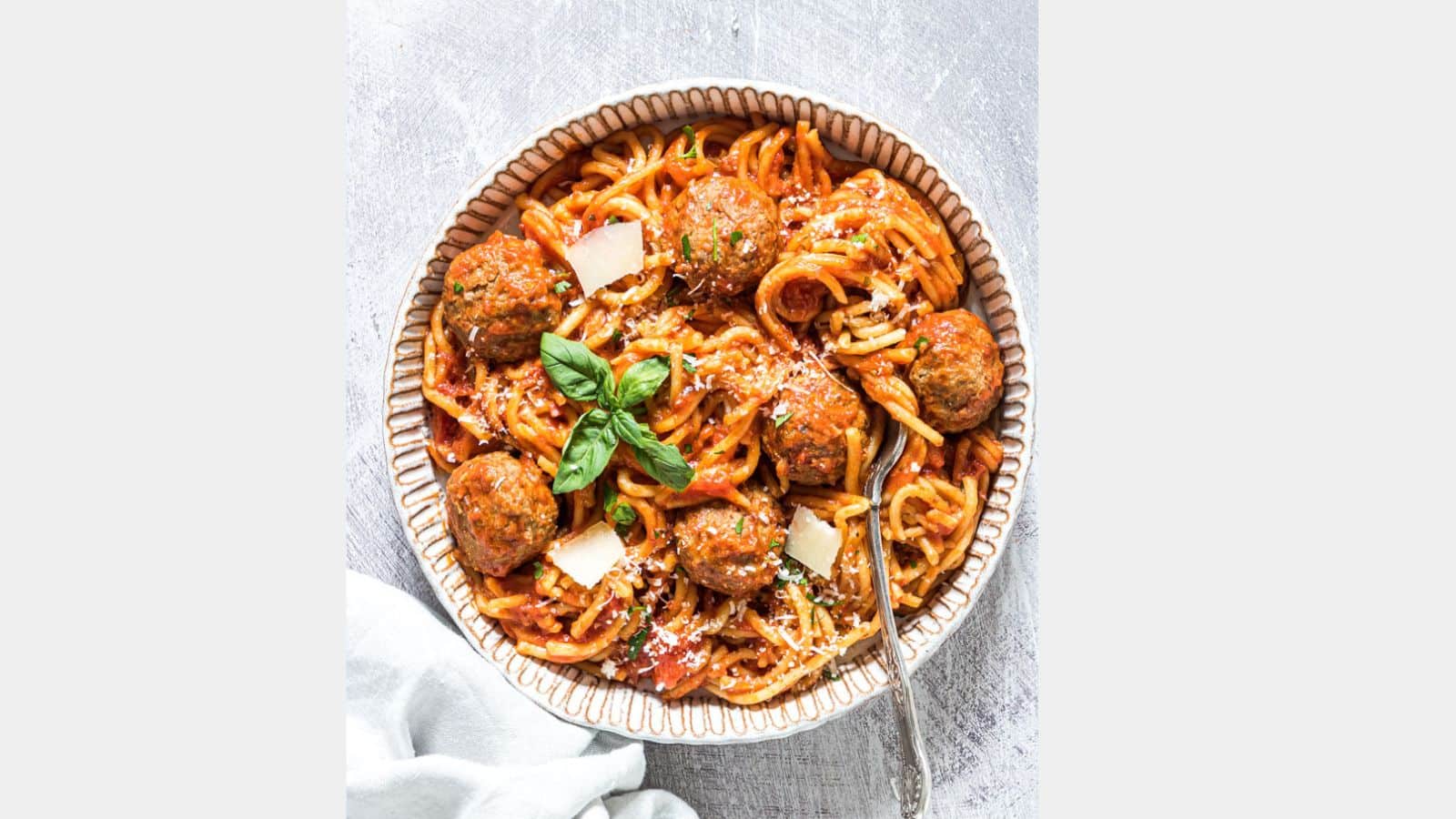 spaghetti and meatballs in a bowl