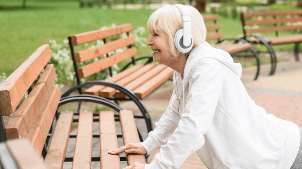 older woman working out with music