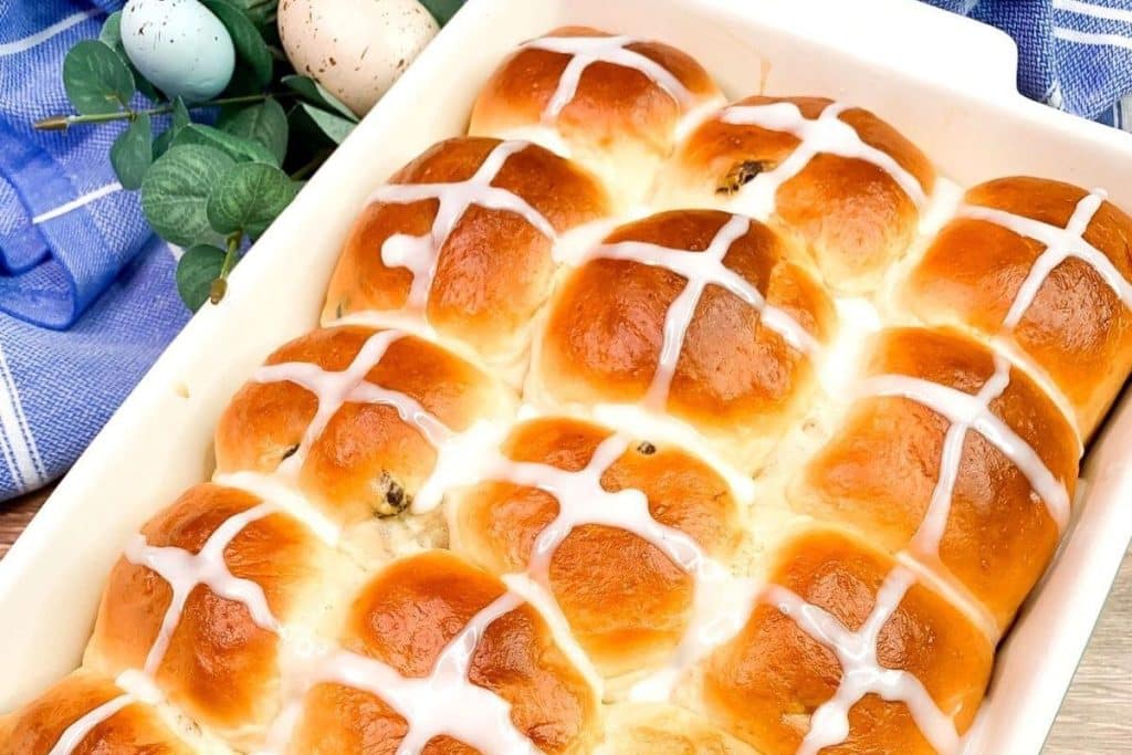 baking dish filled with hot cross buns